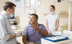 Man talking to dentist