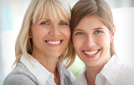 mother and daughter smiling