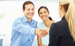 Smiling man and woman talking about dental benefits 