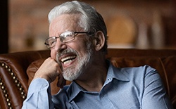 Man with dentures laughing