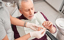 Man getting dentures at the dentist