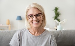 Older woman with dentures smiling