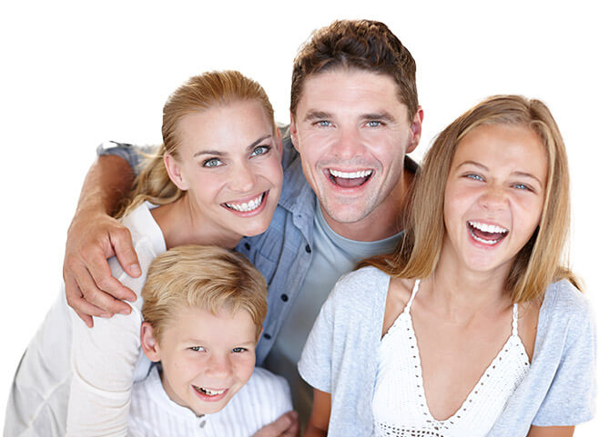 family of four smiling