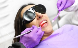 woman being treated with dental laser for gum disease