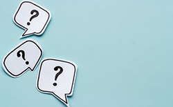 three speech bubbles with question marks in them