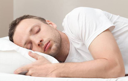 Man sleeping soundly in bed