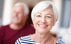 husband and wife smiling