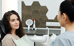 Female patient speaking with dentist