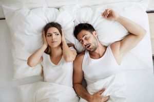 woman annoyed by man’s snoring caused by sleep apnea in Texarkana 