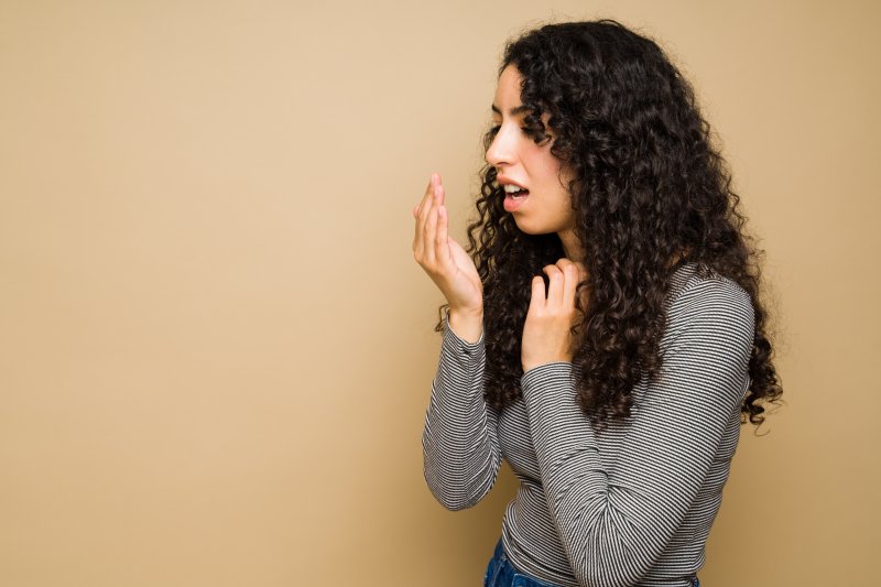 woman testing her breath