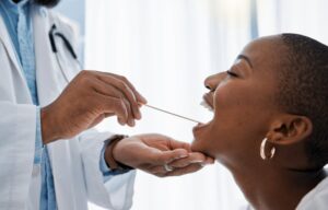 Woman being examined by dentist. 