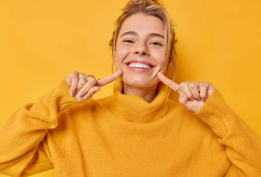 Woman pointing at smile